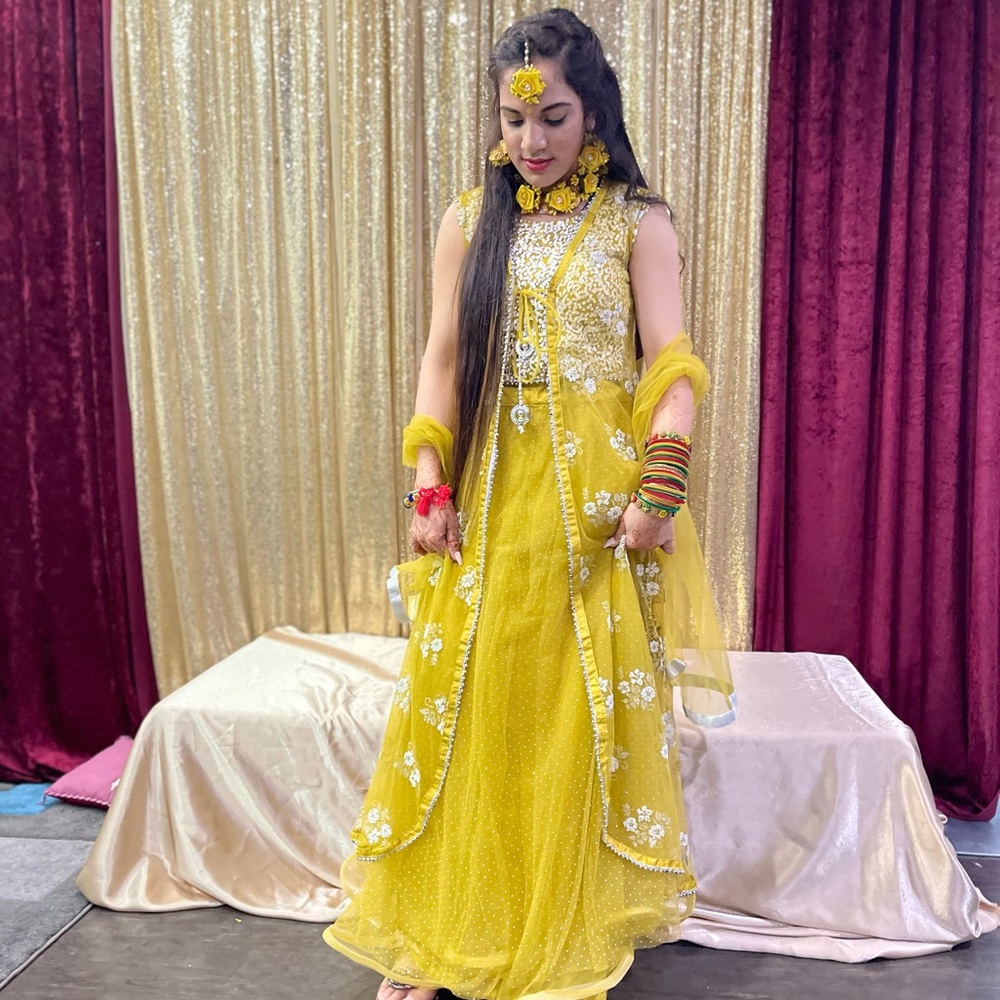 Yellow long skirt (lehnga) with small/medium top with net scarf and shrug on top